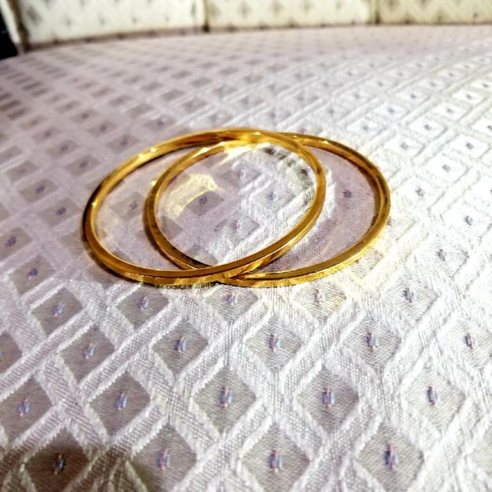 Yellow gold bronze bangles (2).